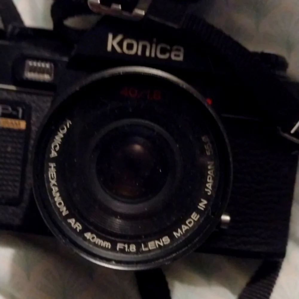 Konica Black Camera with Sunpak Flash